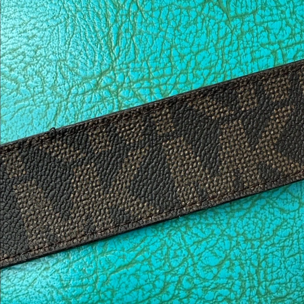 Reversible Michael Kors MK logo belt with bright shiny coral side - see flaw